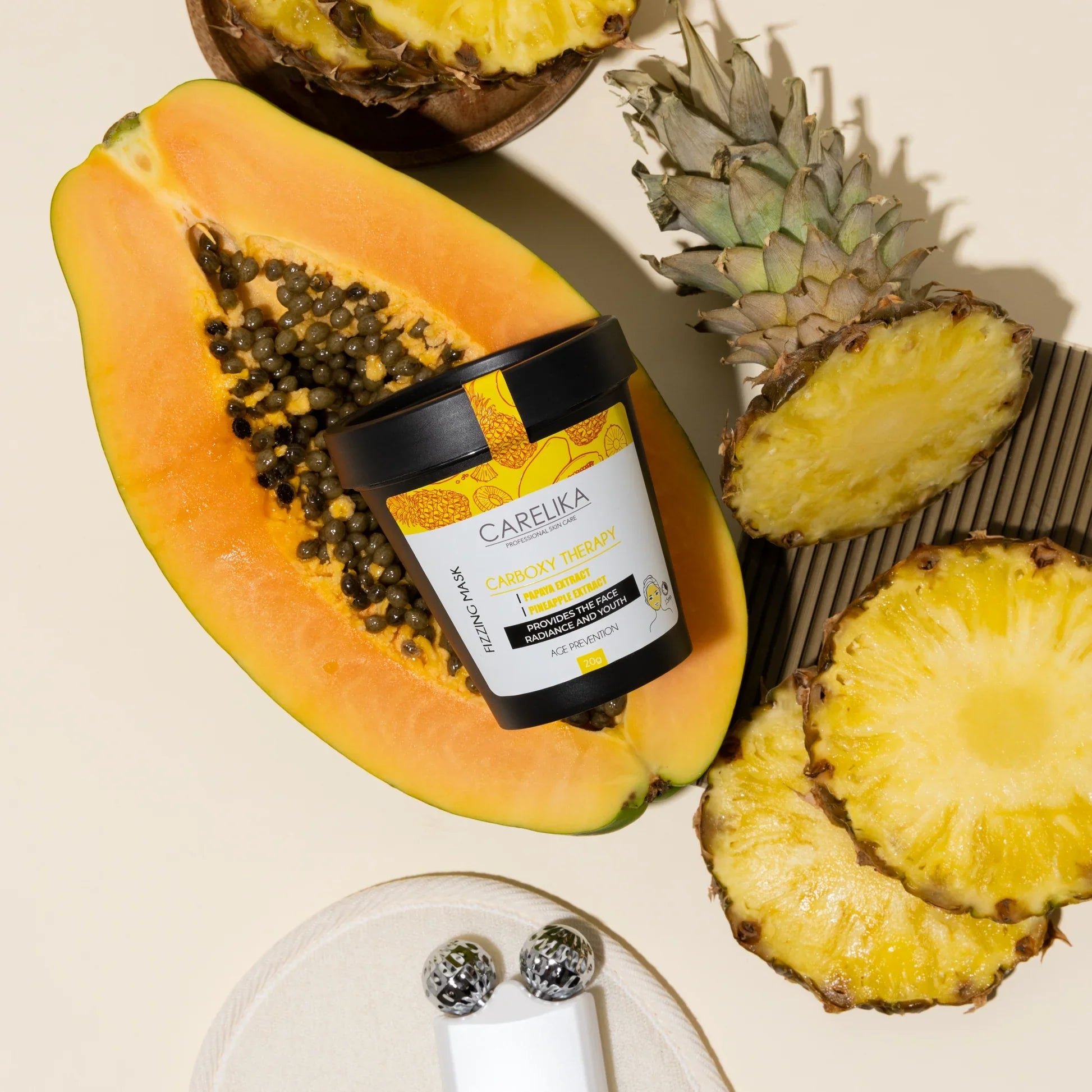 carelika shaker mask, on the background papaya and pineapple